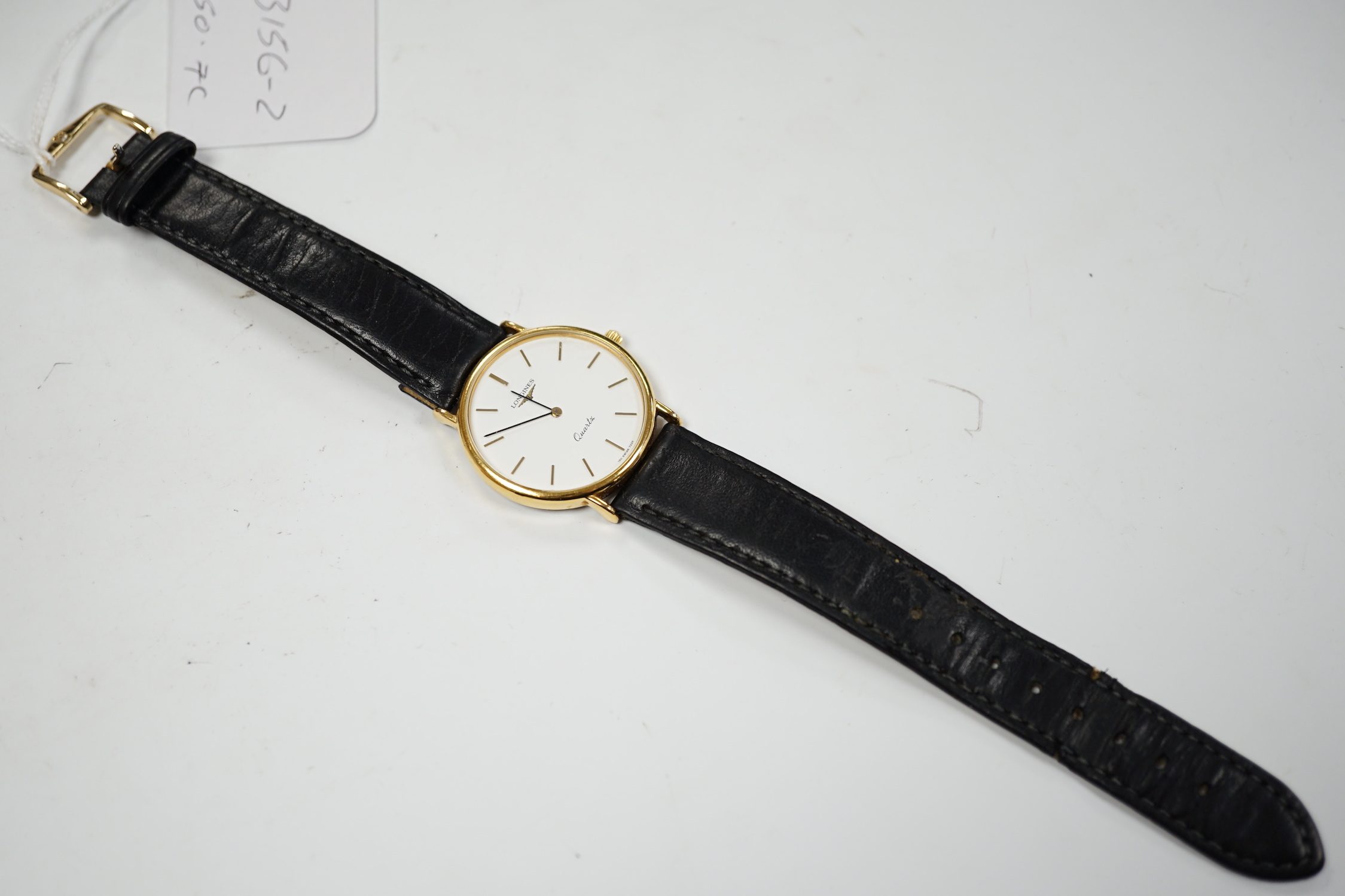 A gentleman's modern steel and gold plated Longines quartz dress wrist watch, on associated leather strap, with Longines box.